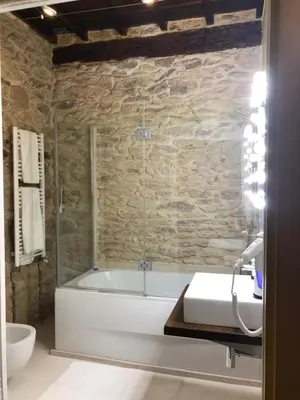 a bathroom with a bath tub and a sink at Pazo de Laia in Palas de Rei