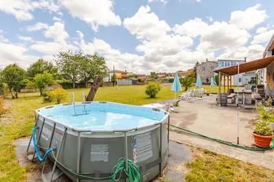 a hot tub in the yard of a house at Casa Mosteiro in Bribes