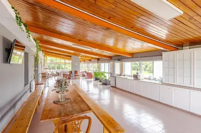 a large living room with a wooden ceiling at Casa Mosteiro in Bribes
