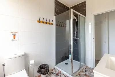 a bathroom with a shower and a toilet and a sink at Casa Mosteiro in Bribes