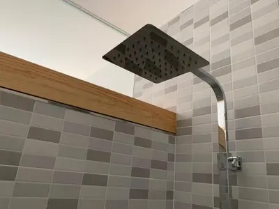 a shower with a shower head in a bathroom at Galerías 16 Viviendas Turísticas in Lugo