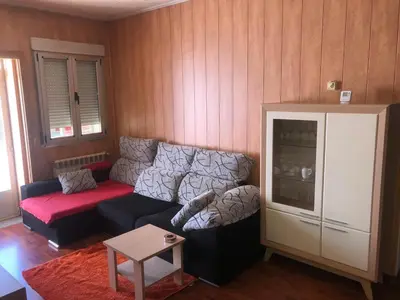 a living room with a couch and a table at HOSTAL CAMELOT in Fabero