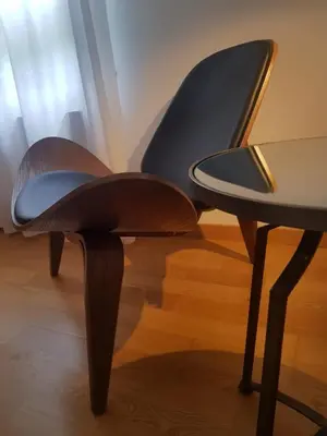 a pair of chairs sitting next to a table at PENSION ROSELLA in O Pedrouzo