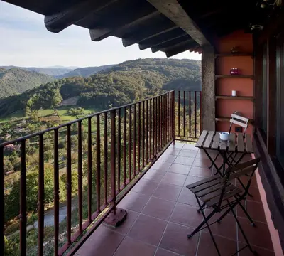 a balcony with a view of the mountains at Casa Vistaboa Ribeira Sacra in Chantada