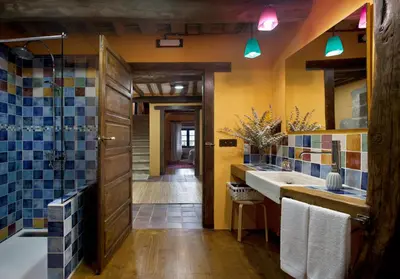 a bathroom with a shower and two sinks and a tub at Casa Vistaboa Ribeira Sacra in Chantada