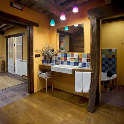 a bathroom with a sink and a mirror and a tub at Casa Vistaboa Ribeira Sacra in Chantada