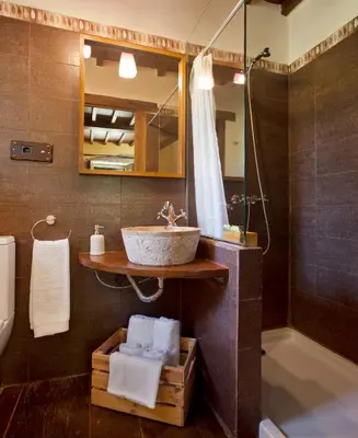 a bathroom with a sink and a shower at Casa Vistaboa Ribeira Sacra in Chantada