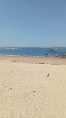 a kite on a beach with the ocean in the background at CHALET CON PISCINA EN MIÑO-Perbes in Miño
