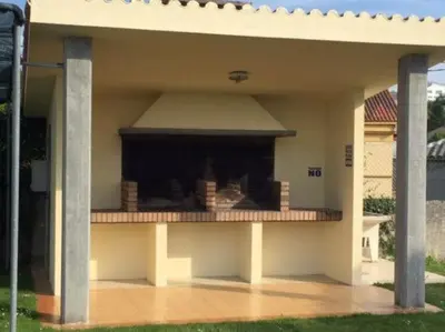 a back porch of a house with a patio at CHALET CON PISCINA EN MIÑO-Perbes in Miño