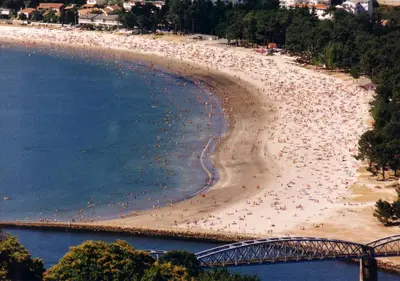 an aerial view of a beach with many people at Hotel Sarga in Cabañas