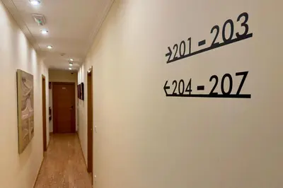 a hallway with a sign on a wall at Hotel Reigosa in Pontevedra
