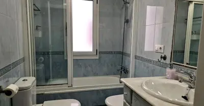 a bathroom with a sink and a toilet and a tub at Soleado a un Paseo de la Catedral in Santiago de Compostela