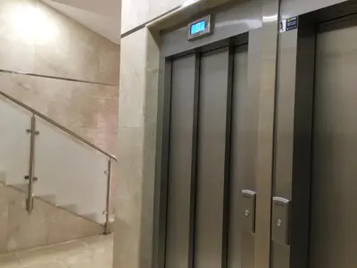 a row of elevator doors in a building at Soleado a un Paseo de la Catedral in Santiago de Compostela