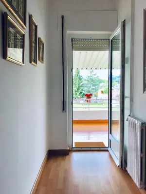 an empty room with a door to a patio at Casa de la Playa in Vega de Espinareda