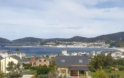 a view of a city and a body of water at Apartamentos Arumes do Mar e Montaña - Viveiro in Viveiro