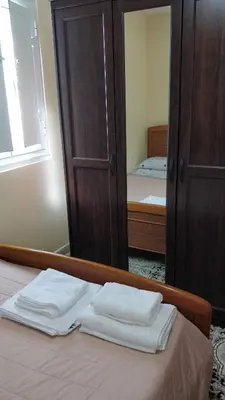 a bedroom with a bed with two white towels on it at Casa do Gaiteiro - Casa de Aldea en O Pereiro in Pereiro