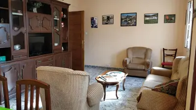 a living room with a couch and chairs and a table at Casa do Gaiteiro - Casa de Aldea en O Pereiro in Pereiro