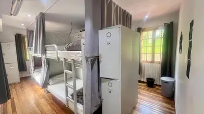 a group of bunk beds in a room at Albergue Mirador de Pedrouzo in O Pedrouzo