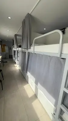 a row of bunk beds in a hospital at Albergue Mirador de Pedrouzo in O Pedrouzo