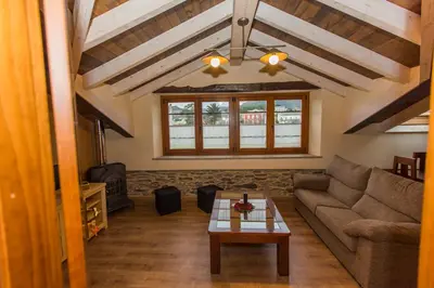 a living room with a couch and a table at Apartamentos Casa Mateo in Navia