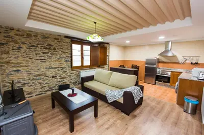 a living room with a couch and a table at Apartamentos Casa Mateo in Navia