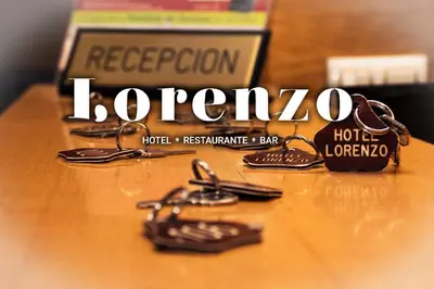a bunch of keys sitting on top of a table at HOTEL LORENZO in Carballino