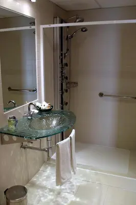 a bathroom with a sink and a shower at Las Fontaninas in Noceda del Bierzo