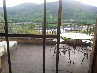 a view of a balcony with a table and chairs at Precioso PISO en Villafranca del Bierzo in Villafranca del Bierzo