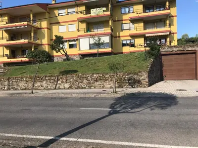 an empty street with a building in the background at Precioso PISO en Villafranca del Bierzo in Villafranca del Bierzo