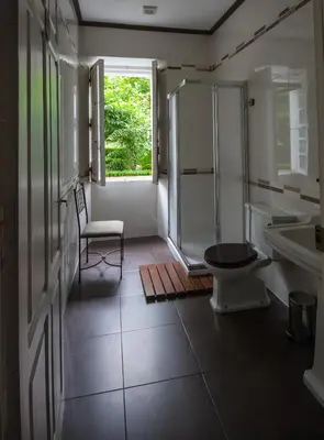 a bathroom with a shower and a toilet and a sink at CASA PELTRE in Sarria