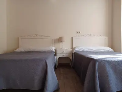two beds sitting next to each other in a room at Casa Perdigueira in Castromayor