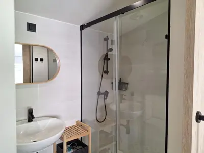 a bathroom with a shower and a sink at Casa Perdigueira in Castromayor