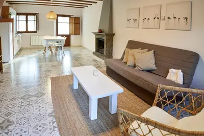 a living room with a couch and a table at El Mirador de Sanabria in Galende