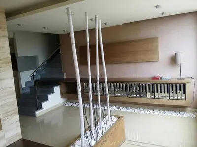 a lobby with a staircase and a stair case at Foz vacaciones a orillas del mar in Foz