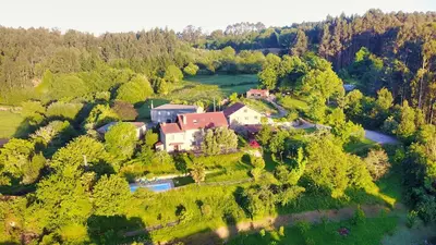an aerial view of a house in a forest at Casa de Sixto in Paderne