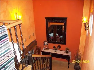 a bathroom with a sink and a mirror at Hotel Rural La Veleta in Murias de Rechivaldo