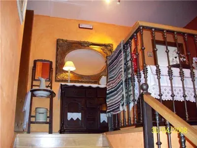 a staircase in a house with a stair railing and a staircasengthngthngthngth at Hotel Rural La Veleta in Murias de Rechivaldo