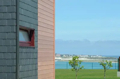 a window on the side of a building at Cabanas Da Barcela in Barreiros