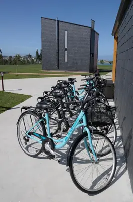 a row of bikes parked next to a building at Cabanas Da Barcela in Barreiros