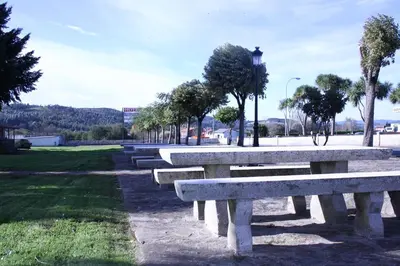 a row of stone benches in a park at Hotel Garcas in Lavacolla