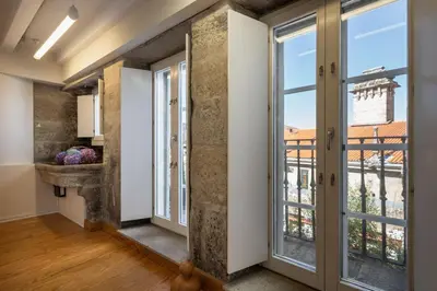 a hallway with sliding glass doors and a balcony at Albergue The Last Stamp in Santiago de Compostela
