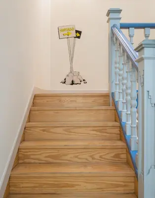a staircase with a basketball hoop on the wall at Albergue The Last Stamp in Santiago de Compostela