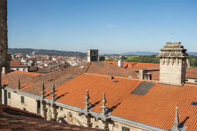 an old building with a red tile roof at Albergue The Last Stamp in Santiago de Compostela