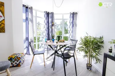 a dining room with a table and chairs and a window at CON PARKING, LocalizacIon Sensacional in Santiago de Compostela