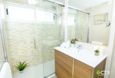 a bathroom with a glass shower and a sink at CON PARKING, LocalizacIon Sensacional in Santiago de Compostela