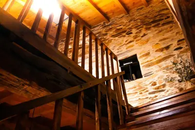 an overhead view of a wooden staircase in a building at CASA RURAL BIERZO ENCANTADO in Valle de Finolledo