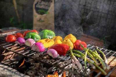 a bunch of vegetables cooking on a grill at Meiga Backpackers Hostel in Santiago de Compostela