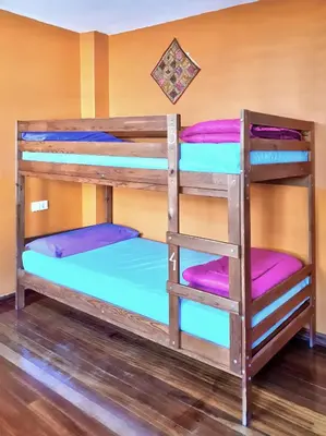 a couple of bunk beds in a room at Meiga Backpackers Hostel in Santiago de Compostela