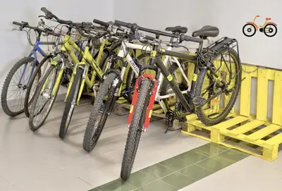 a group of bikes parked in a garage at Meiga Backpackers Hostel in Santiago de Compostela