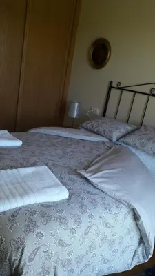 a bedroom with two beds with towels on them at Panoramico Playa de Altar I in Barreiros